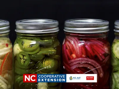 jars of peppers, onions and cucumber pickles