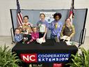 4-h'ers holding ribbons from rabbit show