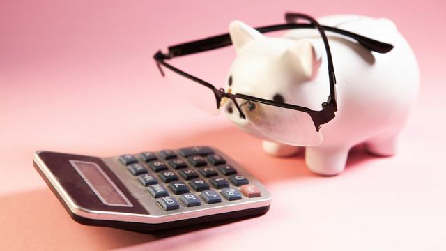 Calculator and piggy bank