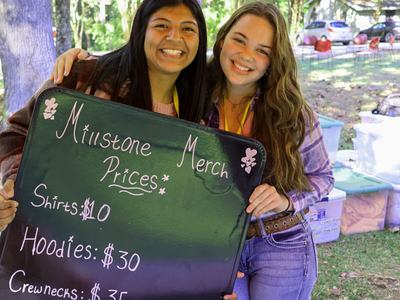 2 women selling merchandise