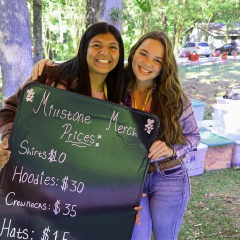 2 women selling merchandise