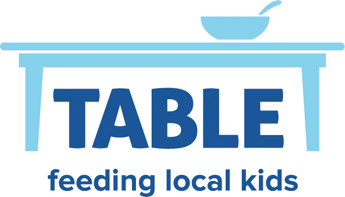 TABLE logo.  Table with bowl on top. TABLE written underneath table and "feeding local kids" written below the organization's title.  Everything written in blue.