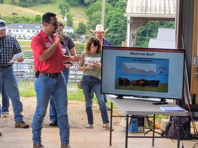 This is a photograph of a NC State Extension Specialist Providing Research Based information about beef cattle production at a field day.
