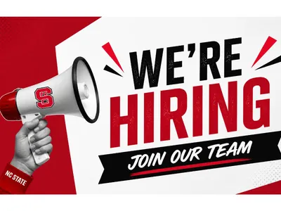 A hand holding a bullhorn saying we're hiring.  Join our team.