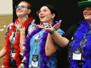 Three 4-H members smile and reach up as confetti falls, as part of a workshop at 4-H Congress.